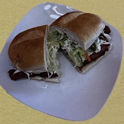 A torta cut in half on a white plate