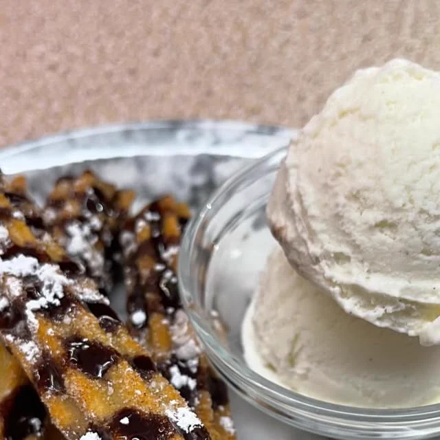 Churros with a scoop of ice cream